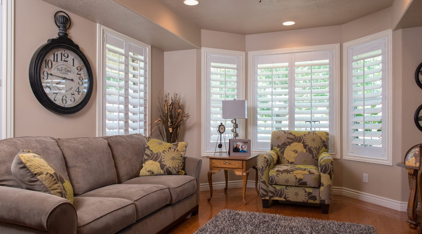  Polywood shutters covering a large window.